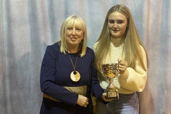 Amy McGinn receives her award (Top GCSE in Physical Education) by Ms Christine Doherty, Principal